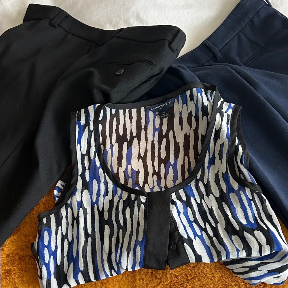 2 pair of crop dress pants and one sleeveless patterned top.